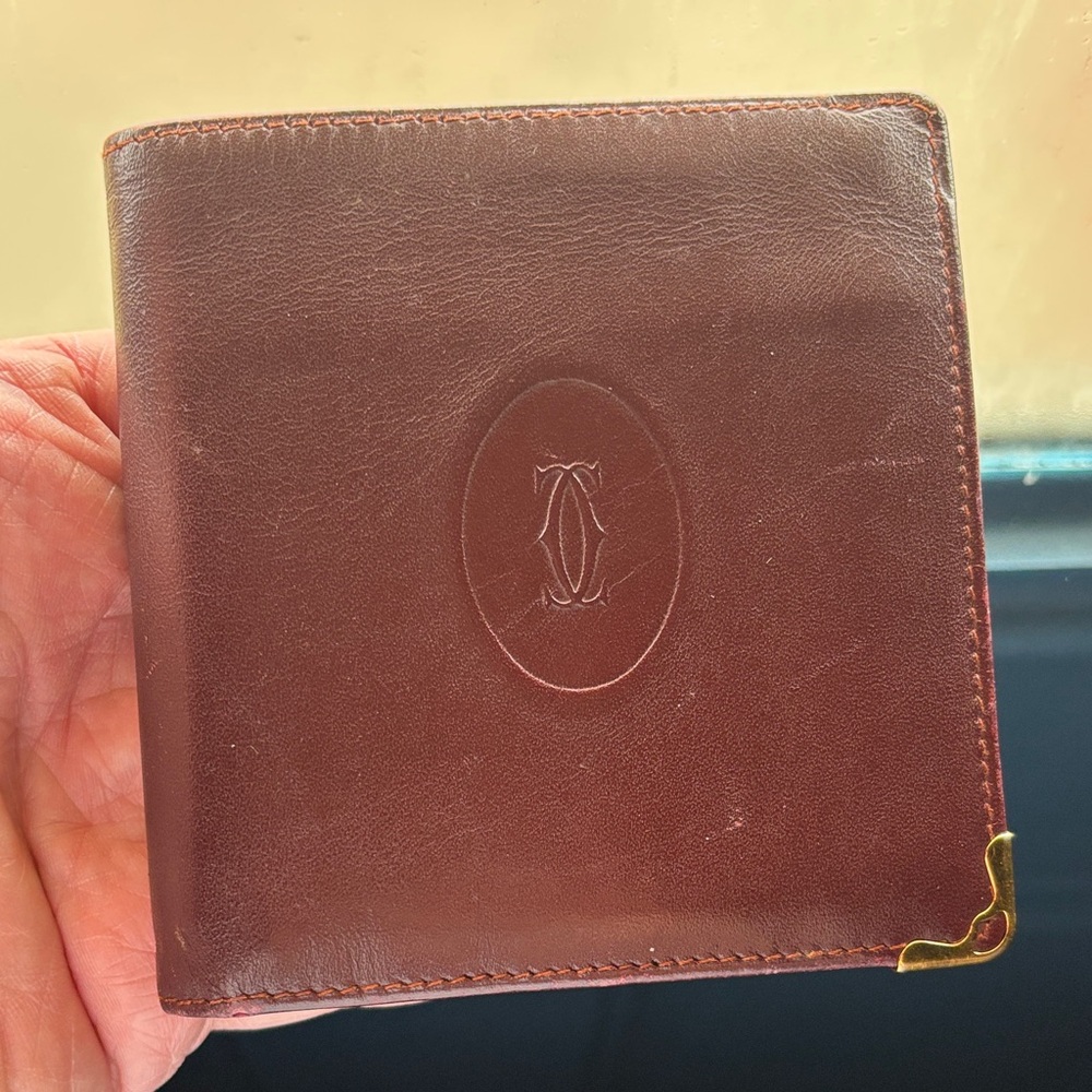 Vintage Cartier bifold wallet in burgundy leather